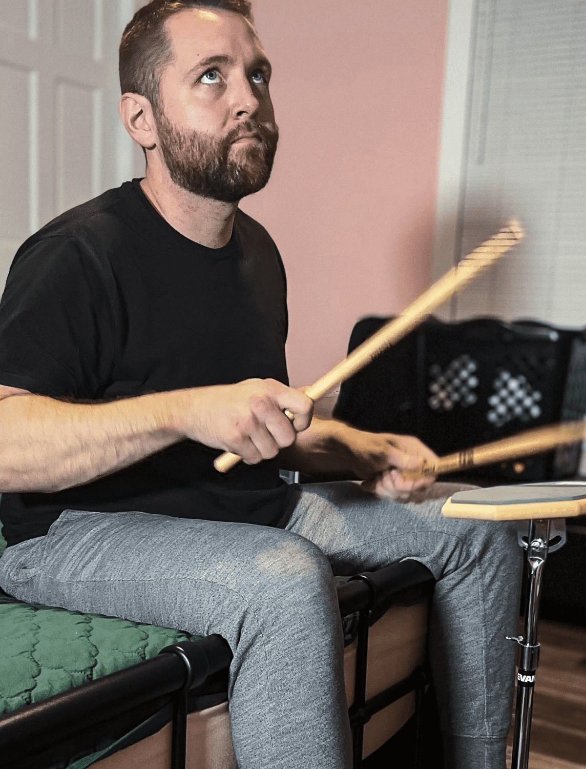 Artist drumming on Real Feel Practice Pad