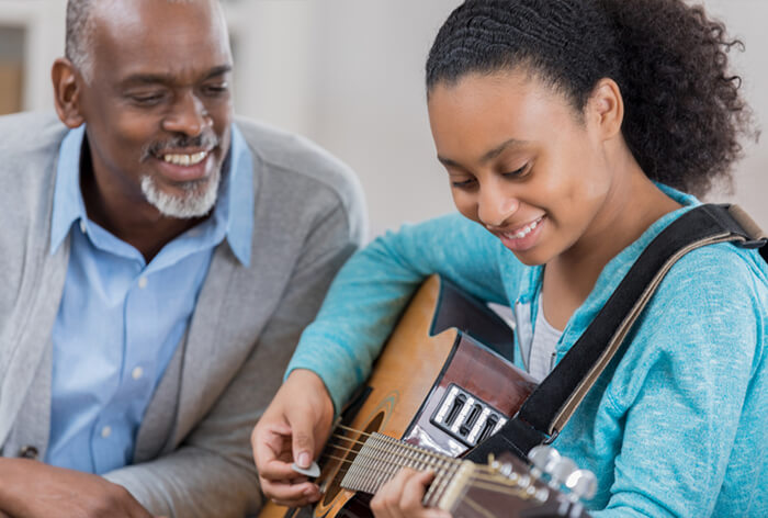 guitar teacher and student