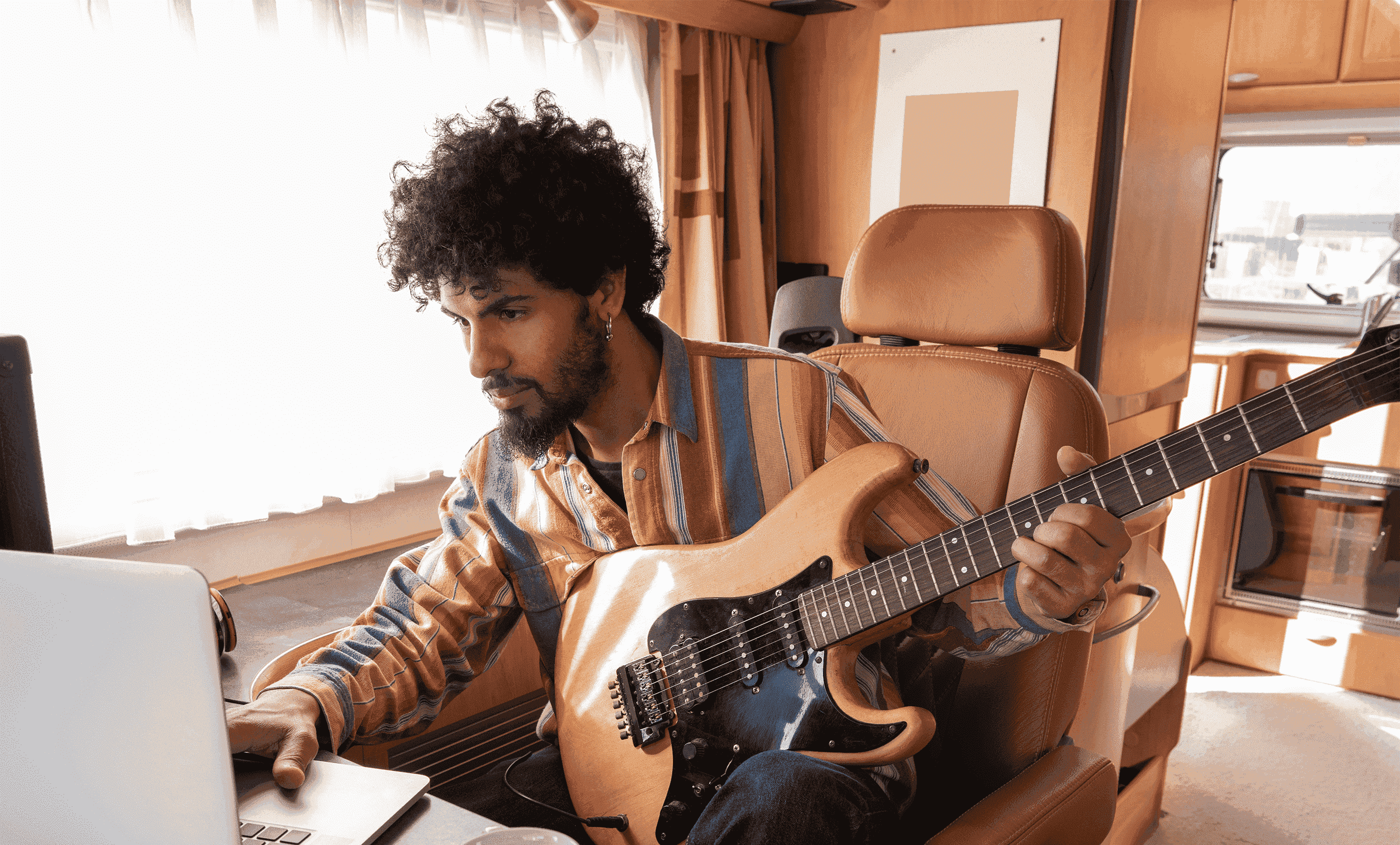 Person playing electric guitar