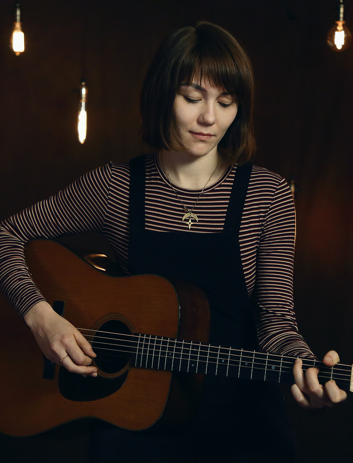 Molly Tuttle playing guitar