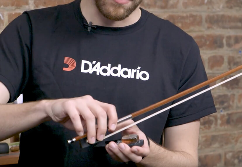 Person using Rosin Your Bow