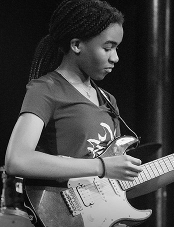 Child playing the guitar