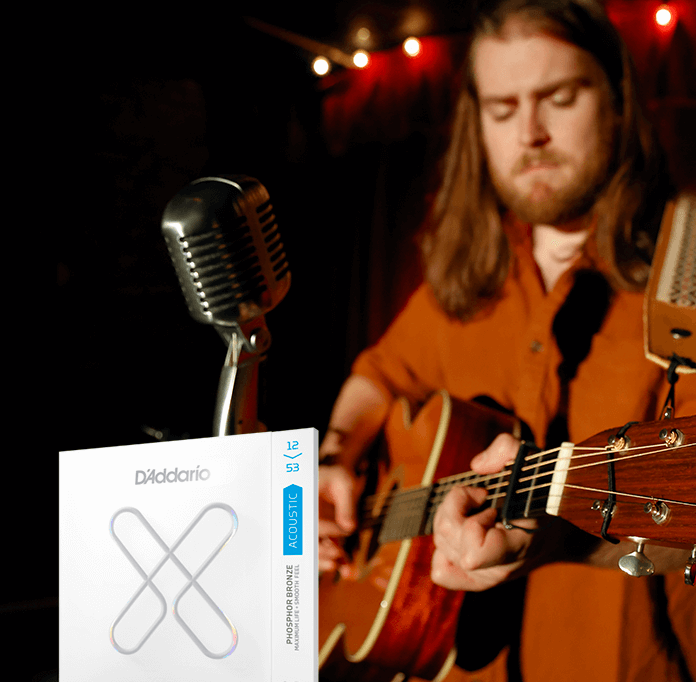 Person playing XS Strings on guitar