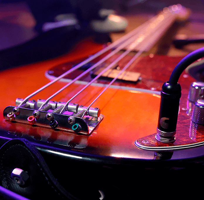 Cable plugged into bass guitar