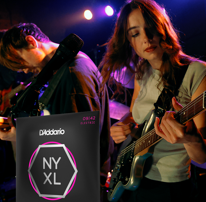 Person playing NYXL Guitar strings